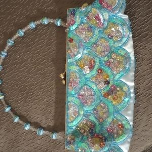 Beautiful embellished bag in turquoise blue with a mix of beautiful colors